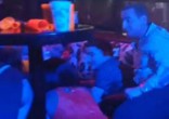 Image of Blue Parrot nightclub patrons huddle under tables as shots ring out (Marcos Vazquez/Twitter).