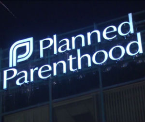 U.S. District Court Judge Sam Sparks issued a preliminary injunction stopping the state from defunding Planned Parenthood.