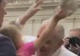Image of Estella removed Pope Francis' skullcap when the Pontiff leaned in for a kiss.