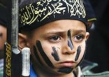 Image of Cubs of the Caliphate are being used to guard Mosul from Christians attempting to return home.