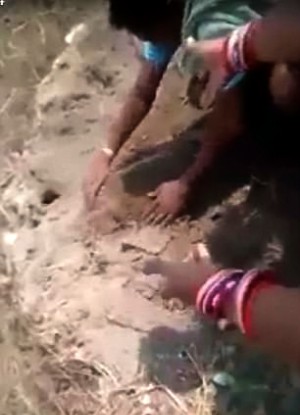 baby girl's feet were found sticking up from the earth.