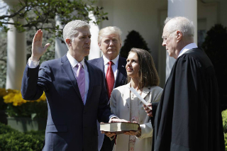 Neil Gorsuch is sworn in at the White House rose garden.