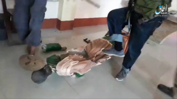 Terrorists stomp and shatter a statue of a saint while ransacking a Catholic church in Mindanao.