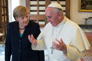 Pope Francis shares a teaching moment with Chancellor Merkel.