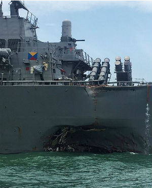 The USS John S. McCain suffers significant damage after a collision with a Liberian-flagged oil tanker.
