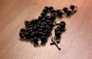 An unnamed woman was found dead with rosary beads stuffed into her mouth.