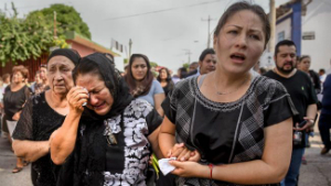 Women mourn as workers search for survivors of the 8.1 quake that struck Mexico in early September.