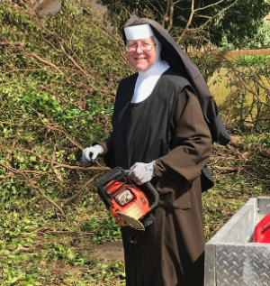 Sister Margaret Ann performing labor with joy, an example to all of us. Photo: Miami-Dade PD