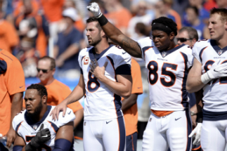 Some players saluted, others protested during the playing of the national anthem at Sunday's football games.