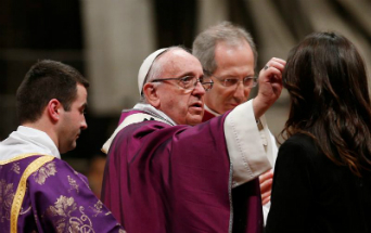 Pope Francis distributes ashes to missionaries during a special Ash Wednesday Mass.