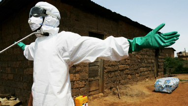 A worker is disinfected after clearing a house of a plague victim. There are inconclusive reports the disease can kill within three hours. Such fast-killing diseases typically burn themselves out before they can spread far. The WHO has sent 1.2 million doses of antibiotics to the region.