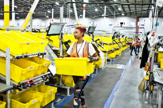Amazon workers are being replaced by robots, but they aren't being laid off either. The growth of online retail means they can fill other roles, as the workload increases.