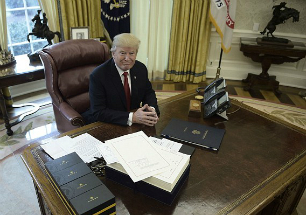 President Trump signed the tax cut bill early as a Christmas present for the American people.