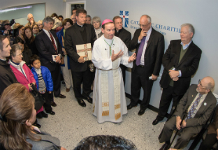 Bishop Burbige blesses the new clinic.