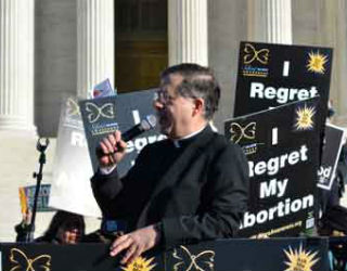 Father Frank Pavone, national director of Priests for Life, speaks during the Silent No More gathering in front of the Supreme Court at the 2018 March for Life in Washington, D.C.
