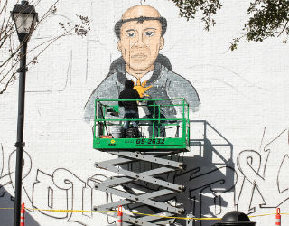 he mural, of St. Thomas Aquinas surrounded by Houston landmarks, will be located on the side of Crooker Center.