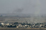 Image of Smoke rises from the Syrian town of Ras al Ayn during the Turkish offensive against Kurdish groups in northeastern Syria Oct. 17 2019 as seen from Turkey.