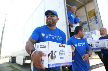 Members of the Knights of Columbus help to deliver supplies to the Casa de Migrantes in Ciudad Juarez Mexico