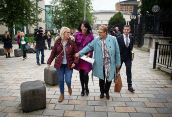 Sarah Ewart L Jane Christie R and Grainne Teggart C leave Belfast High Court