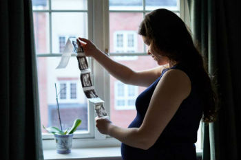 Pregnant woman looking at ultrasound