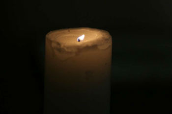 Lit candle at the memorial for Orlando at St. Patrick's Catholic Church in Rome