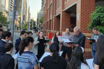 Image of A group of local Catholics gathered outside Melbourne prison on Christmas Eve to sing carols for Cardinal George Pell