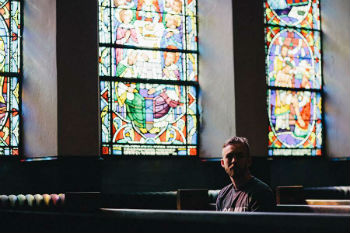 Image of Young man in church