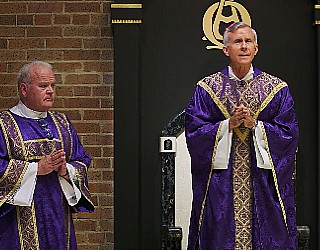 Image of Bishop Strickland and Deacon Keith Fournier holding Sunday Mass.