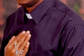 Image of African priest praying
