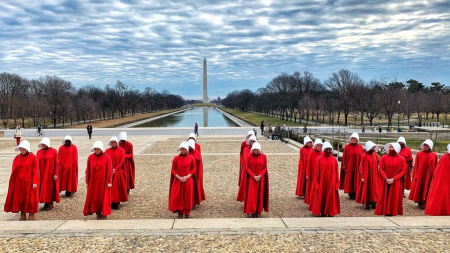 Image of Anti-life protestors dressed as 'Handmaids.' The costume comes from 'The Handmaid's Tale' by Margaret Atwood, about a dystopian future where most women are sterile and those who can conceive are enslaved for the purpose of producing children for social elites. Sadly, such persons fail to recognize that pro-life is also pro-woman, and anti-life is anti-woman. You cannot be more opposed to women than to abort female children. 