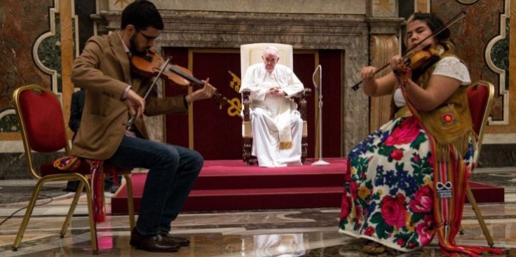 Image of Indigenous musicians play for Pope Francis. The Holy Father is going to Canada to offer an apology for Church behavior towards the Indigenous people. 