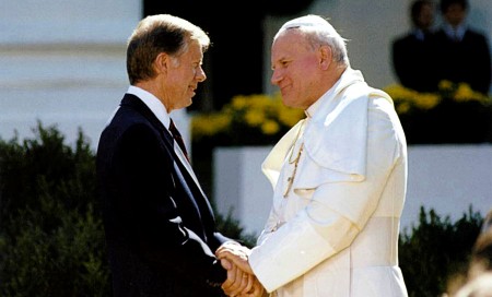 Image of The late Jimmy Carter was the first US President to welcome a Pope into the White House with Pope John Paul II. [Image Credit: Wikimedia Commons]
