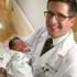 Image of GYNECOLOGIST HOLDS INFANT -- Dr. Daniel Greene holds infant MacKenzie Grace Couch at Crittenton Hospital in Rochester Hills, Mich., in early January. Greene, a gynecologist and parishioner of St. Mary of the Hills Parish, said his faith led him to a decision that he will no longer prescribe birth control. He joins a minority of doctors who have a natural family planning-only practice. (CNS photo/ Michigan Catholic) 
