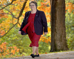 Image of NUN WITH DISEASE WALKS – Sister Peggy Mahoney, director of planned giving for the Diocese of Wilmington, Del., walks in late October. The Mercy sister was diagnosed in 2003 with polymyositis, an autoimmune disease, though she is determined not to let the disease take over her life or define who she is. (CNS photo) 
