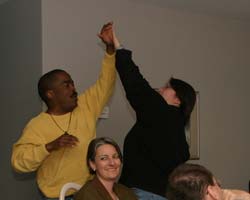 Image of Two Pittsburgh Steelers fans celebrate during a Super Bowl party earlier this year that was hosted by the Northwest Arkansas Catholic Singles. (Arkansas Catholic photo)