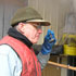 Image of BENEDICTINE SAMPLES SYRUP IN PRIORY – Benedictine Brother Augustine Carroll samples this year's first batch of maple syrup in early March at Weston Priory in Vermont. The 