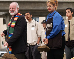 Image of JESUIT ANTI-GANG EFFORT BREAKS GROUND FOR NEW FACILITY IN LOS ANGELES
Jesuit Father Greg Boyle, center, is assisted by youths from Homeboy Industries as he breaks ground on the organization's new headquarters in Los Angeles in early March. The 21,000-square-foot center will house a cafe, catering kitchen, offices, a counseling room and other services to assist youths breaking away from the gang lifestyle. (CNS photo)
