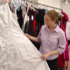 Image of Samantha Mosher, prevention educator at the Sexual Assault Service Center of Guardian Angel Community Services, sifts through donated gowns at the center in Joliet, Ill, in early April. Nearly 40 girls attended a safety course on dating and then received a free prom dress, shoes, jewelry and other accessories gathered in a drive organized by Mosher for the first time this year. (CNS photo)