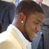 Image of Reggie Bush greeted every child at the Holy Rosary student assembly during which he donated $50,000 to keep the high school program going. Catholic Schools superintendent Father William Maestri told the USC All-America, 