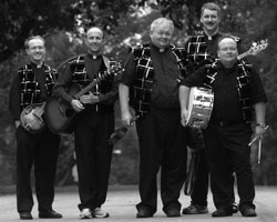 Image of MEMBERS OF KANSAS CITY PRIEST BAND - Members of the Priest Band are, from left, Father Kent O'Connor, Father Mark Mertes, Father Ken Kelly, Father John Reynolds and Carl Parry. The four priests of the Archdiocese of Kansas City, Kan., and Parry, a layman who is studying for the permanent d iaconate, have been putting in a lot of hours lately, rehearsing for their next gig. (CNS/The Leaven)
