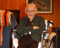 Image of 105-YEAR-OLD PRIEST IN RETIREMENT CENTER – Benedictine Father Angelo Zankl, a 105-year-old resident of St. John's Abbey Retirement Center in Collegeville, Minn., sits inside the facility in late July. Father Zankl has seen many changes in his 105 years, but says 