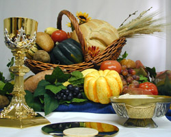 Image of THANKSGIVING GRACE – The foods of the secular Thanksgiving feast are pictured with the spiritual food of the Eucharist – the word in Greek means gratitude or thankfulness. The prayer before the meal at the Thanksgiving Day can be a time of reflection and gratitude for those assembled around the dining room table.(CNS/courtesy Southern Nebraska Register)