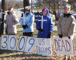 Image of WEEKLY WITNESS FOR PEACE - Sisters Madeline Clifton, Rosalie Ruesewald, Ann Michele Raley and Elise Forst demonstrate against the war in Iraq at Creekmore Park in January.
