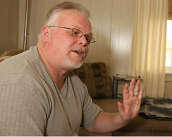 Image of CATHOLIC WRONGLY CONVICTED OF MURDER GESTURES – Kirk Bloodsworth, who was wrongly convicted of the rape and murder of a 9-year-old Rosedale, Md., girl in 1985, gestures during an interview at his home in Cambridge, Md., in late January. Bloodsworth, who became a Catholic while on death row in Maryland, was exonerated by DNA evidence in 1993. Since then he has devoted his life to ending the death penalty. (Catholic Review)
