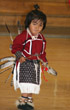 Image of COMMUNITY REVIVES ANNUAL DANCE TRADITION - Two-year-old Derrick Cooper shows off his feathers, clothing and bells to an audience of 50 during the St. John’s Indian Festival March 4.  (Photo/The Catholic Sun/Ambria Hammel)

