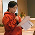 Image of Kasey Fitzpatrick and Kaitlyn Dedman, sixth-grade students at St. Ann School in Nashville, Tenn., report on a service project they conducted as part of a class Kindness Challenge in late January. St. Ann teacher Meghann Robinson gave each of her students $10 and charged them to use the money to help someone. Kaitlyn and Kasey collected donations for the YWCA Domestic Violence Center. The project was inspired by Oprah Winfrey, who recently gave members of her audience $1,000 and told them to do something good with it. (CNS photo/Andy Telli, Tennessee Register) 