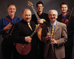 Image of MEMBERS OF MUSIC BAND BOYS OF THE LOUGH – Brenden Begley, Dave Richardson, Malcom Stitt, Cathal McConnell (with glasses) and Kevin Henderson are members of the Celtic music band Boys of the Lough. Even after playing professionally for 40 years, Catholic member Cathal McConnell, a flutist and vocalist for the band, finds there are some songs that are too sensitive to make the group's repertoire, namely those about religion and politics. (CNS/courtesy of Boys of the Lough)