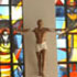 Image of LITURGICAL DANCER LEADS GROUP DURING DEDICATION OF MISSISSIPPI CHURCH – 
Linn Byrd, a member of the Sacred Heart Praise Dancers, leads youths in a liturgical dance during the dedication of the new Sacred Heart Church and Parish Center in Camden, Miss., in late March. The African-American Catholic community in Camden had been hoping for a new church since an earlier mission church closed in the 1970s. (CNS photo/Fabvienen Taylor, Mississippi Catholic) 
