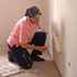 Image of VOLUNTEER GROUPS HELP BUILD AND RENOVATE - A volunteer shares her painting skills to help complete a building project to benefit homeless or needy families. Volunteer opportunities are available through the Catholic Network of Volunteer Service and the Catholic Campaign for Human Development. (Photo Illustration/CNS)
