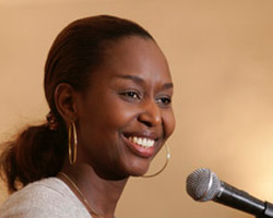 Image of RWANDAN GENOCIDE SURVIVOR SPEAKS - Rwandan genocide survivor Immaculee Ilibagiza gestures while sharing her story of survival and forgiveness at Blessed Sacrament Catholic Church in Alexandria, Va., in 2006. During another speaking engagement, Ilibagiza stood before 600 people April 18 o n the stage of the Caldwell College student center auditorium in Caldwell, N.J., and discussed how the power of prayer saved her life 13 years ago. (CNS)
